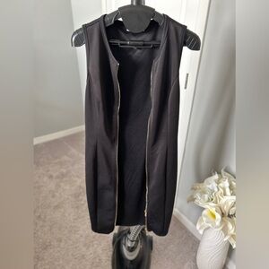Calvin Klein convertible dress into a maxi vest. Zip up to be worn as a dress